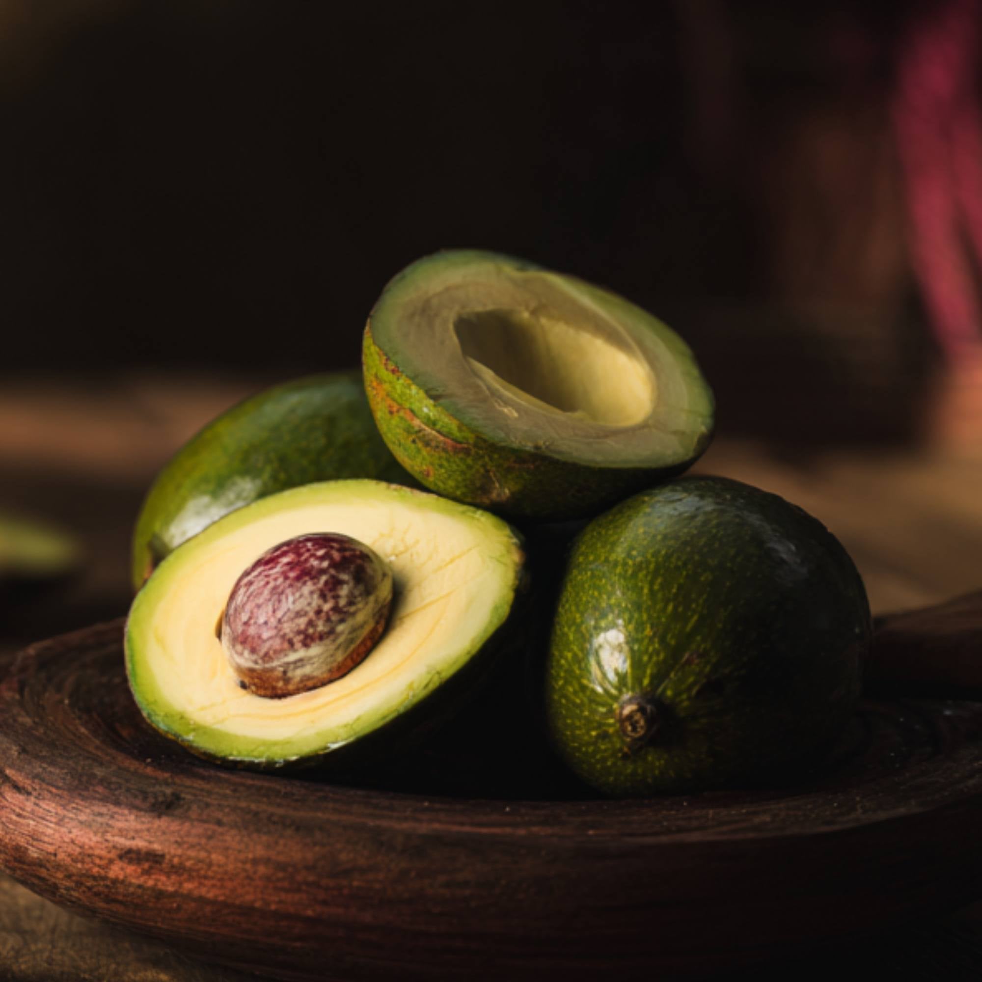Fresh Jamaican avocado with smooth green skin, whole and ready to eat, authentic Caribbean avocado from The Black Farmer