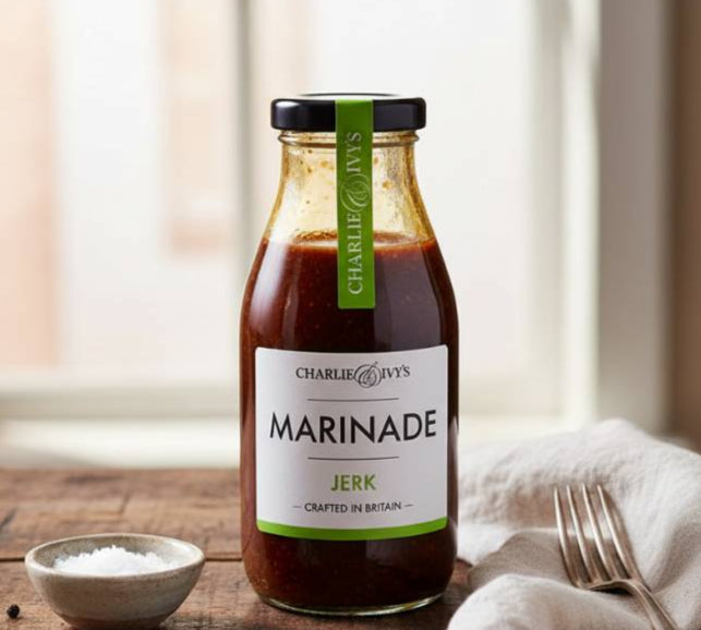 Bottle of Charlie & Jevy's Marinade on a wooden table with a fork and salt.
