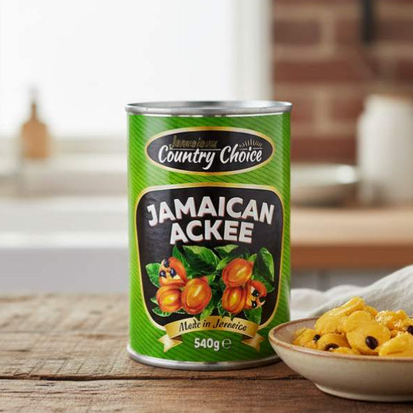Country Choice Jamaican Ackee 540g can beside a bowl of cooked ackee in a Caribbean kitchen.