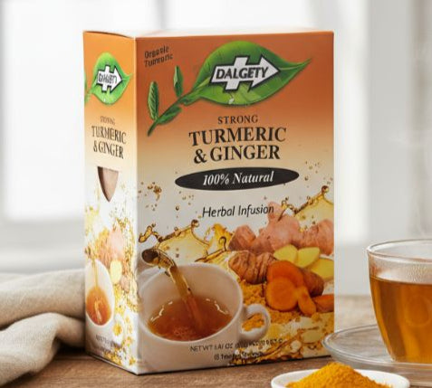 Dalgety Turmeric & Ginger Tea 40g — Caribbean herbal tea box beside cup of golden turmeric tea.