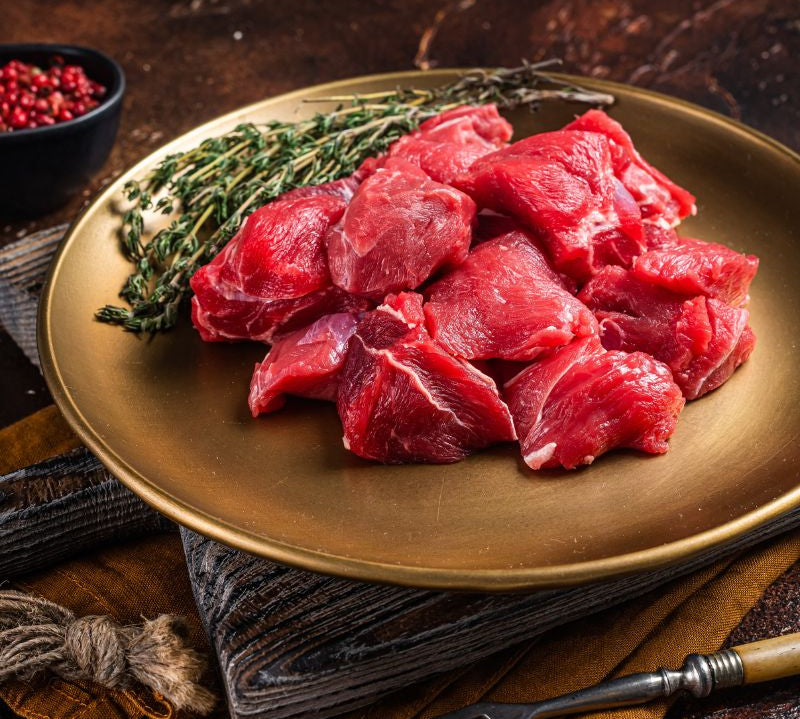 Boneless diced British lamb pieces in pack, high-protein cut ideal for stews, curries and slow-cooked meals.