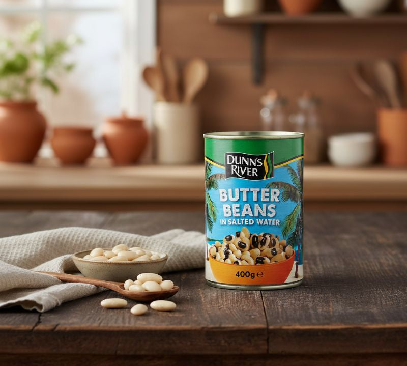 Can of Dunn's River Butter Beans on a wooden table with kitchen background