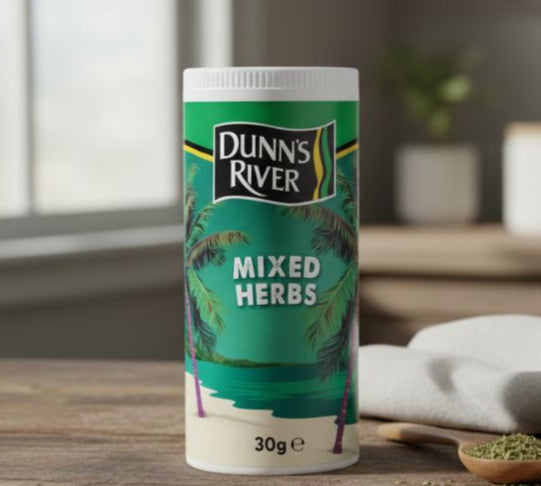Dunn's River Mixed Herbs container on a wooden surface with a blurred background