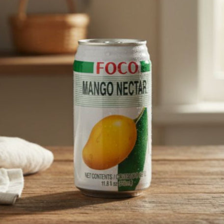 Can of Foco Mango Nectar on a wooden surface with a blurred background