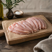 raw free range breasts fillets on a wooden board, ready for cook