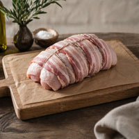 Free range boneless turkey breast crown rolled and topped with bacon, ready for roasting.