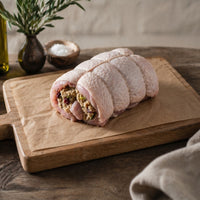 Free Range boneless turkey breast crown rolled with gluten-free stuffing, raw joint for roasting.