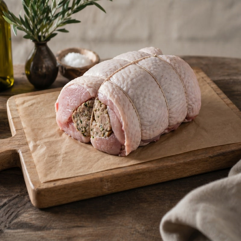 Boneless rolled turkey breast crown filled with gluten-free sage and onion stuffing, ready for roasting — The Black Farmer.