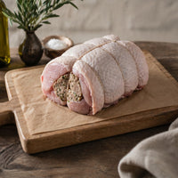 Boneless rolled turkey breast crown filled with gluten-free sage and onion stuffing, ready for roasting — The Black Farmer.