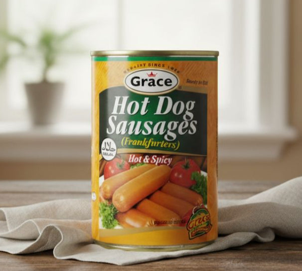 Grace Hot Dog Hot Spicy Halal 400g tin with hot dogs and chili peppers on wooden surface.