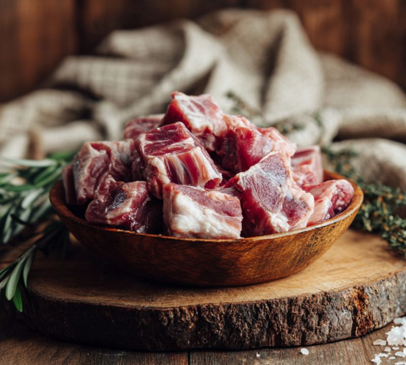 Bone-in British lamb neck stewing pieces, ideal for slow cooking, stews, curries, and hearty family dishes.