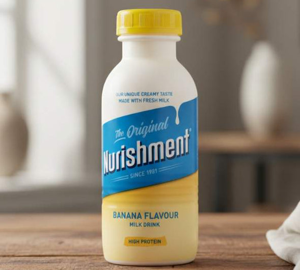 Bottle of Nurishment Original Banana Flavour Milk Drink 330ml on wooden table with glass of milk.
