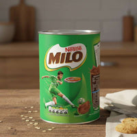 Nestle Milo packaging on a wooden table with a cup of coffee