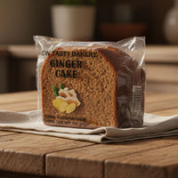 Packaged ginger cake from New Tasty Bakery on a wooden table with a blurred background