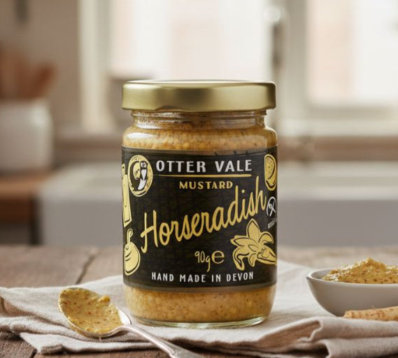 Jar of Otter Vale Mustard Horseradish on a wooden table with a blurred background