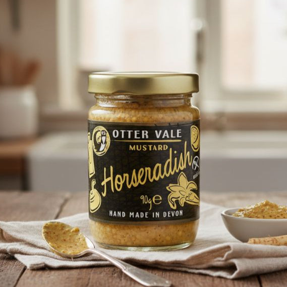 Jar of Otter Vale Mustard Horseradish on a wooden table with a blurred background