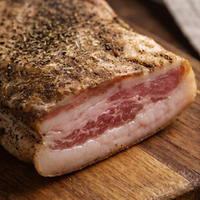 Pork Guanciale Cheek on a wooden cutting board