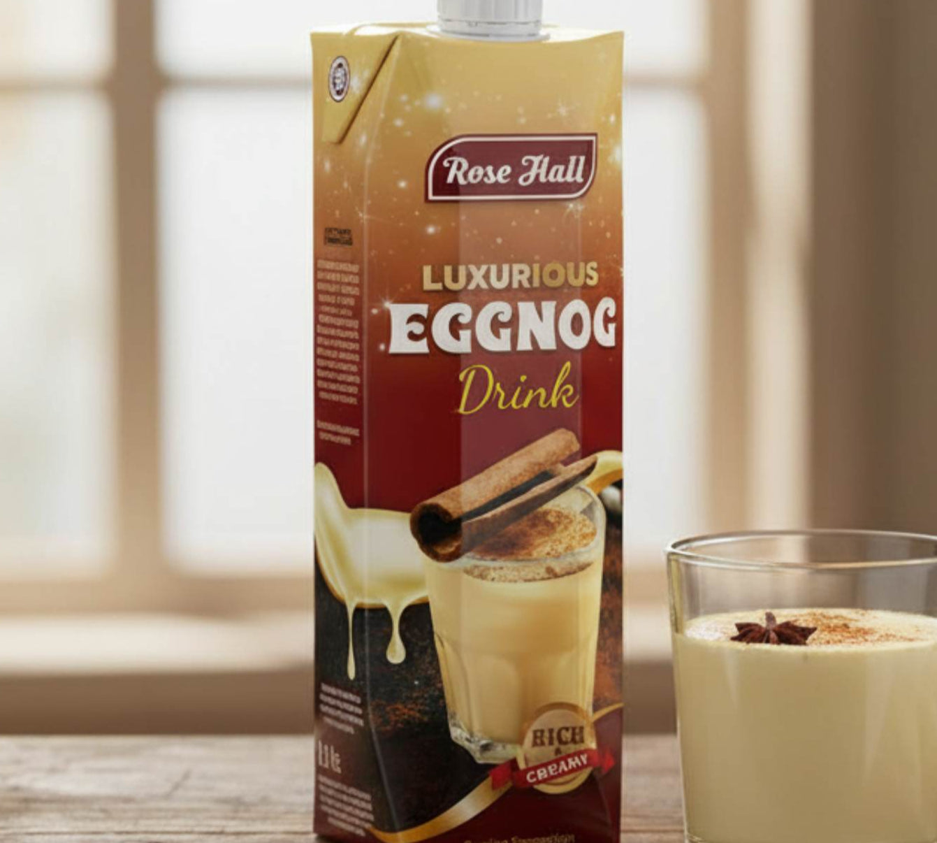 Rose Hall Luxurious Eggnog Drink carton with a glass of eggnog on a wooden table.