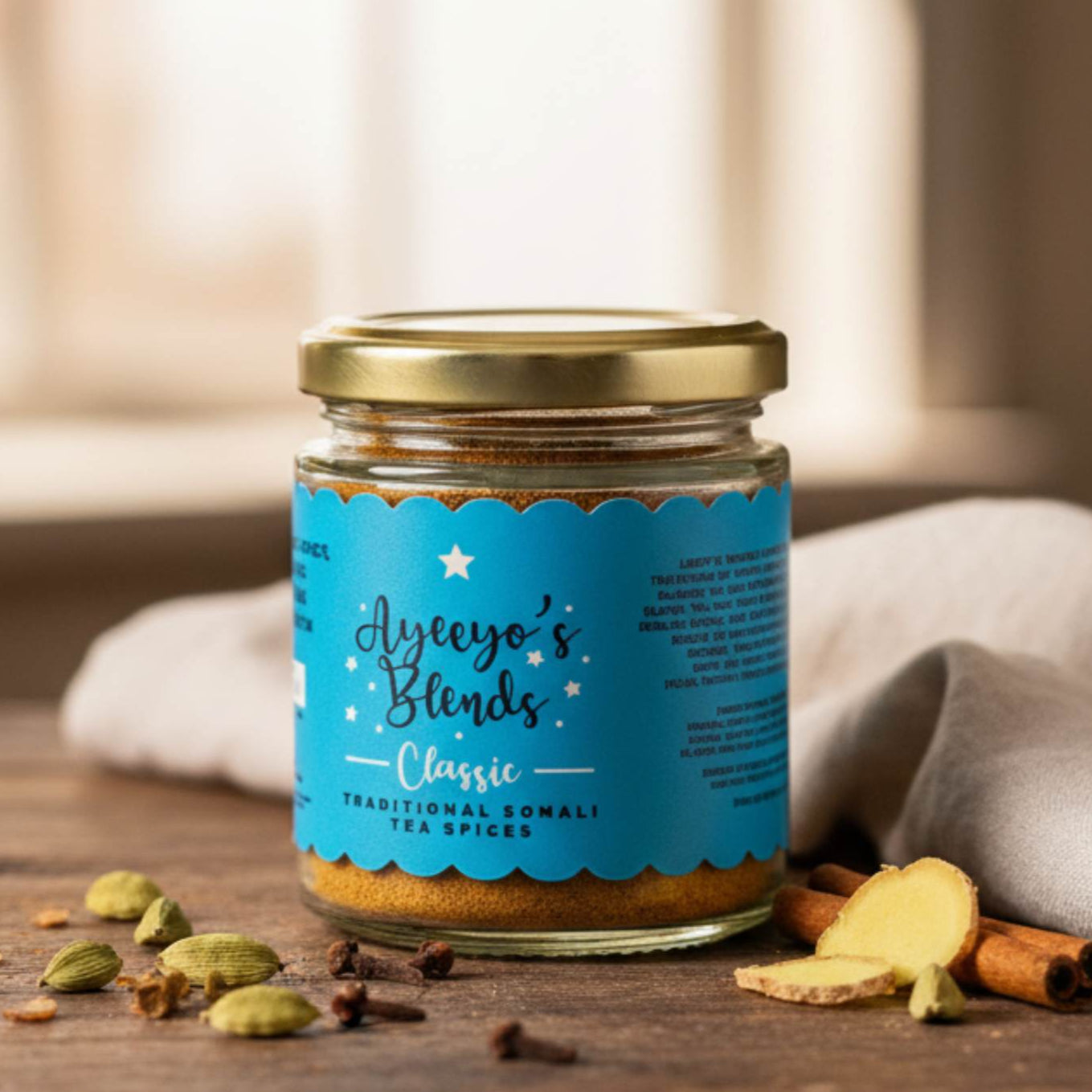 Jar of Ayeoyo's Blends on a wooden surface with spices around