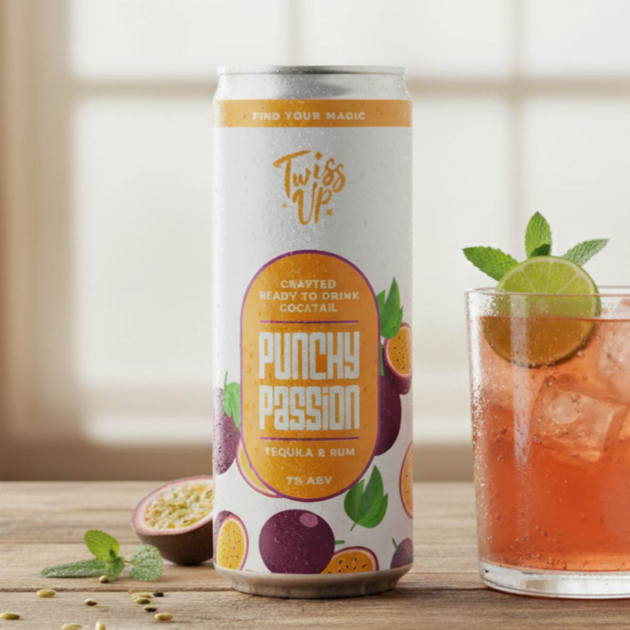 Can of Twisted Punchy Passion drink on a wooden surface with a glass of the drink.