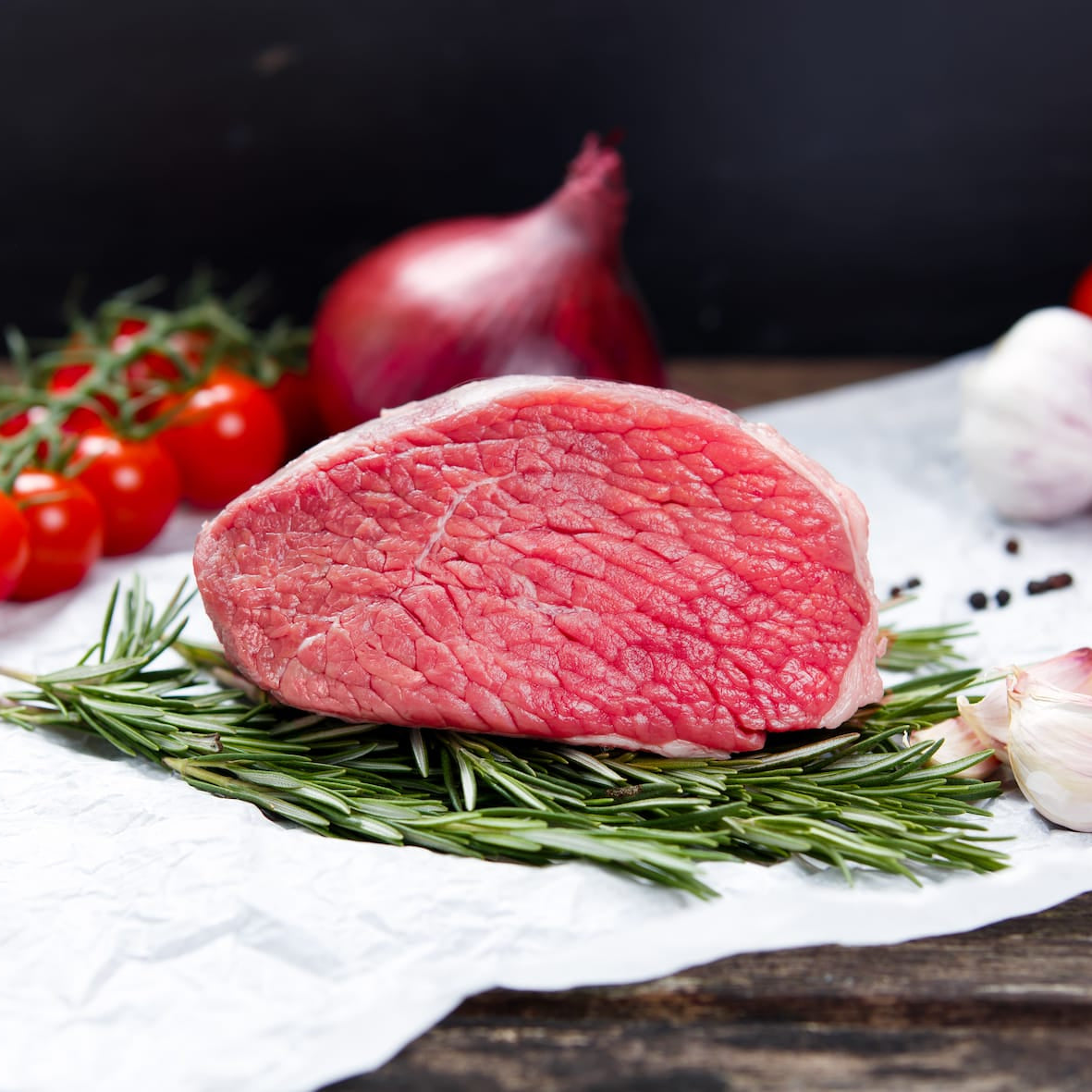 British veal topside joint rolled and trimmed, lean tender meat ready for roast