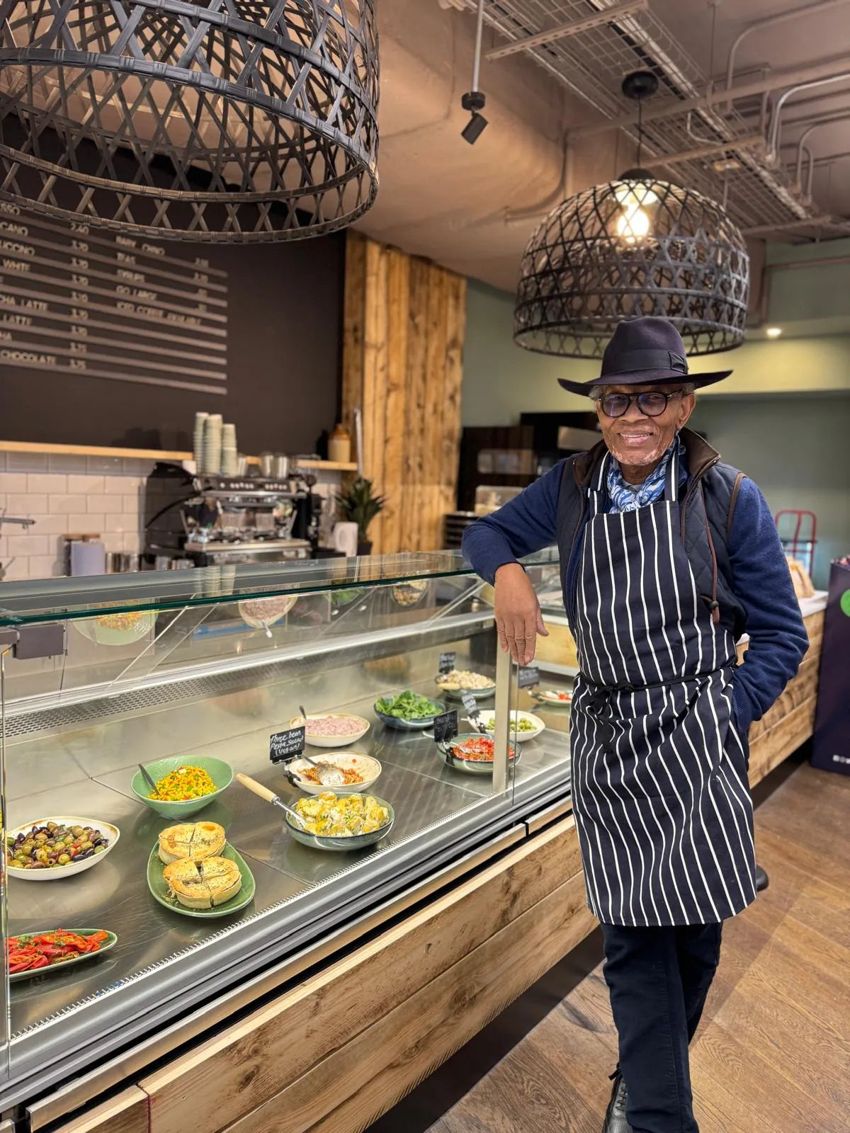 Wilfred_at_the_counter_in_our_White_City_Store.webp