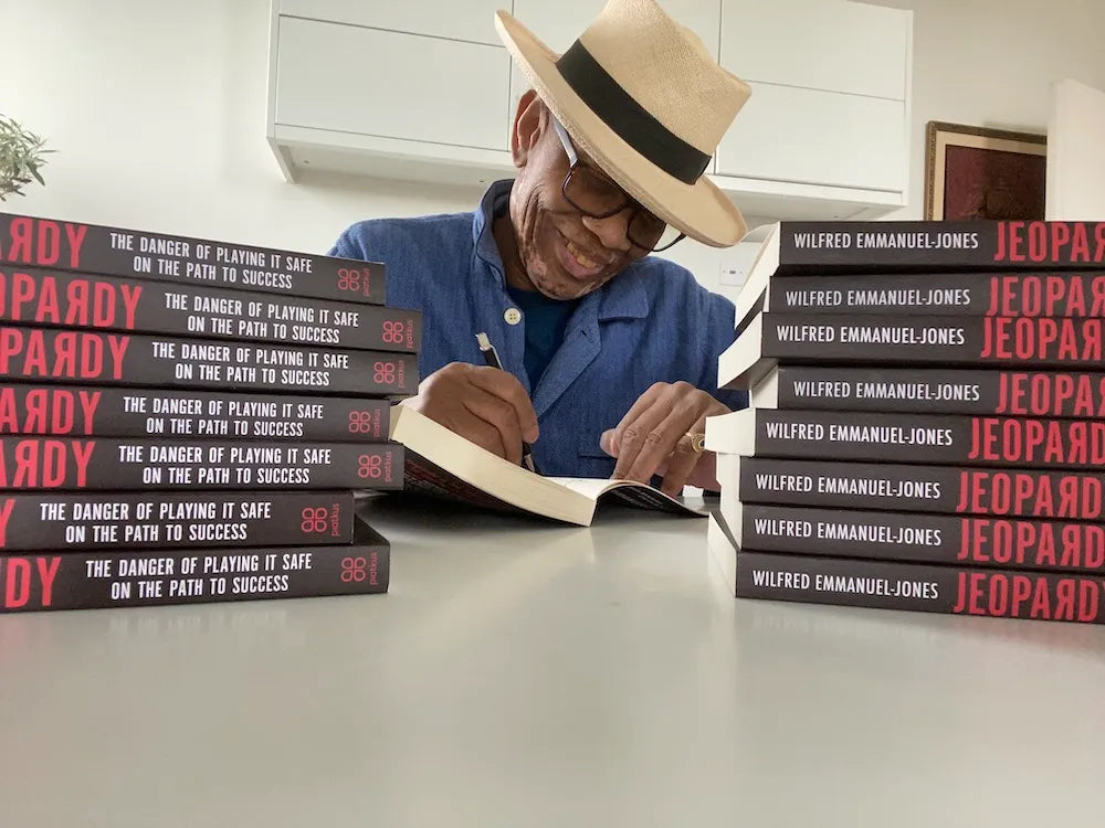 Wilfred_signing_his_book.webp