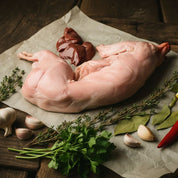Whole British rabbit on tray, lean game meat ideal for roasting or stews