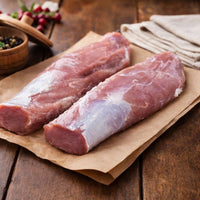 Free range pork tenderloin on a wooden board — premium British pork loin ideal for roasting, diced pork, pork chops and pork roast joints. Buy pork online.