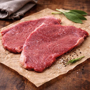 Lean British beef minute steak, thin-cut topside, ideal for quick cooking and high-protein meals.