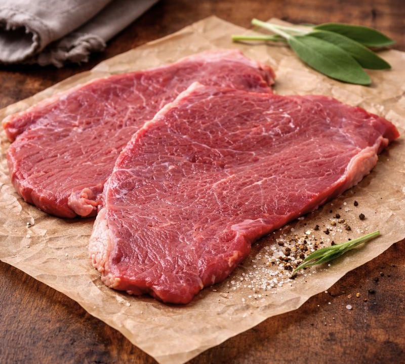 Lean British beef minute steak, thin-cut topside, ideal for quick cooking and high-protein meals.
