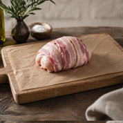 The Black Farmer Chicken & Bacon Mini Roast — British chicken wrapped in smoky bacon, oven-ready for family meals.