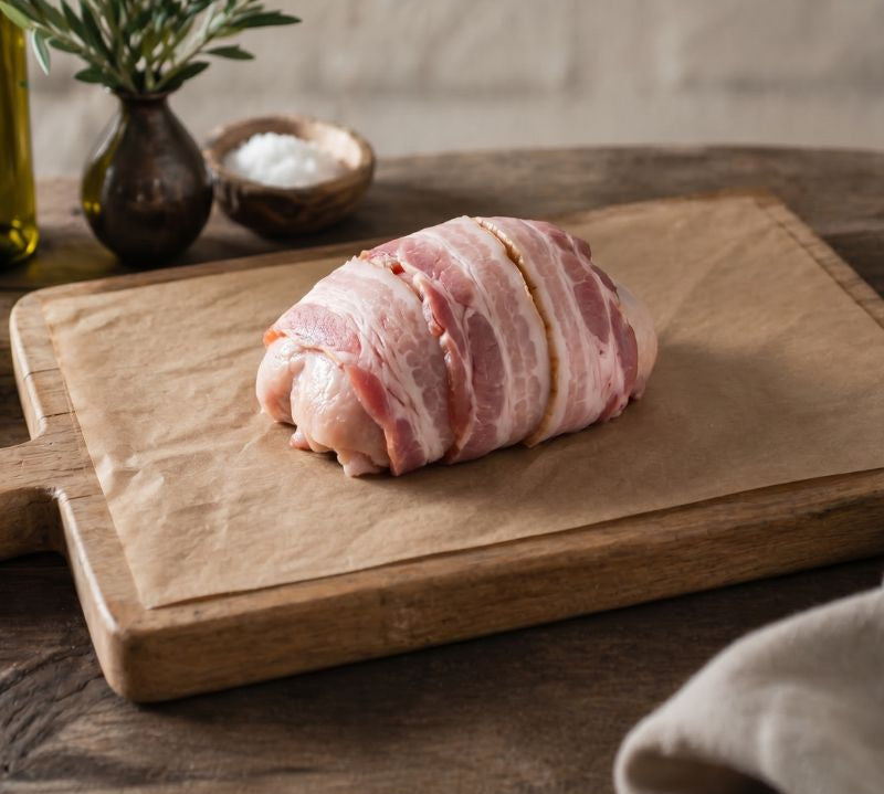 The Black Farmer Chicken & Bacon Mini Roast — British chicken wrapped in smoky bacon, oven-ready for family meals.