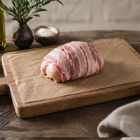 The Black Farmer Chicken & Bacon Mini Roast — British chicken wrapped in smoky bacon, oven-ready for family meals.