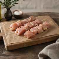 Diced free-range chicken breast kebab pieces in pack, gluten-free, ready for grilling or pan-frying.