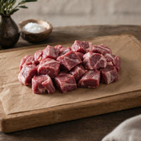 Boneless diced British lamb pieces in pack, high-protein cut ideal for stews, curries and slow-cooked meals.