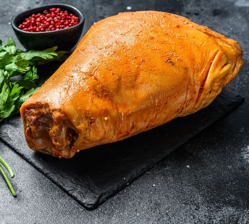 Smoked cured gammon hock from The Black Farmer — traditional British pork, cured and smoked for rich flavour, perfect for stews or roasting.